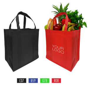 Two shopping bags in black and red filled with fresh fruits and vegetables