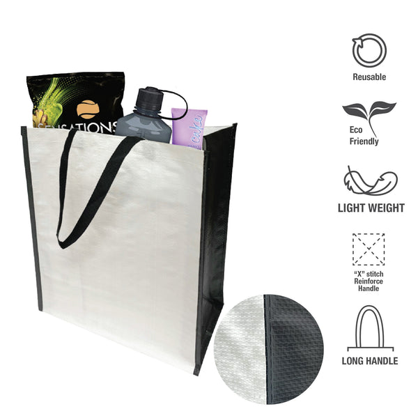 A shopping bag with black handle and white interior filled with groceries