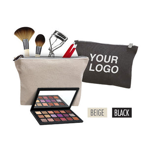 A makeup canvas bag with a brush, makeup brush, and a mirror.