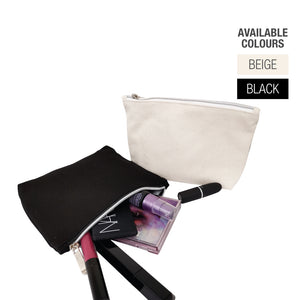 Two canvas bags with zipper in black and white containing beauty products and accessories