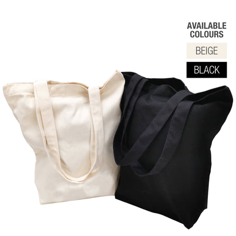 Two canvas tote bags, one black and one white, displaying the words "available colours" in bold lettering.