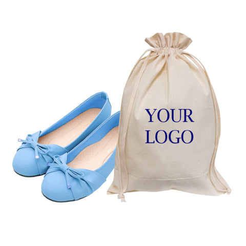 A personalized cotton canvas bag with a drawstring closure near a pair of shoes