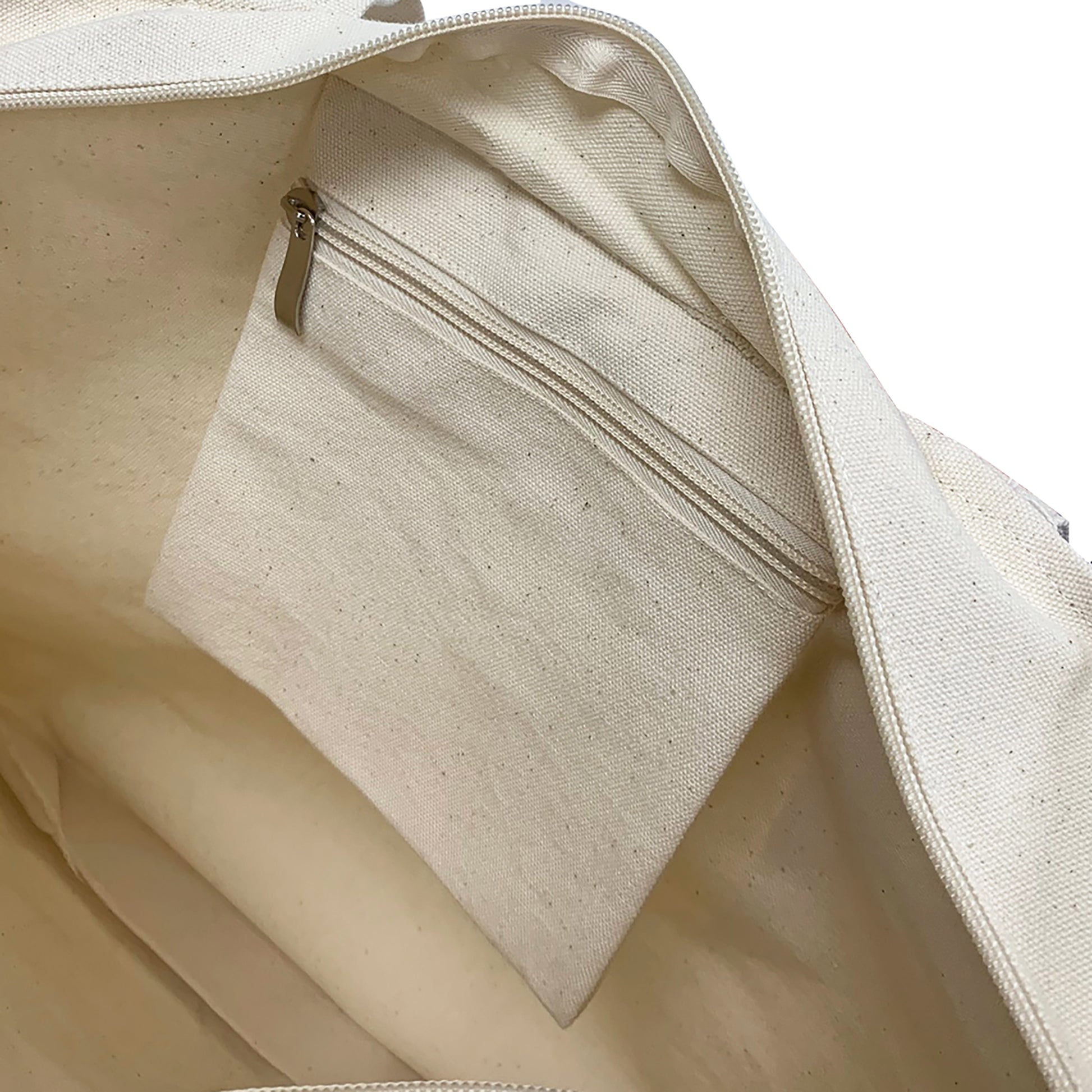Close-up of a beige canvas bag inside pocket with zipper