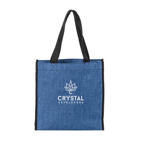 A blue denim tote bag with black handles featuring a white crystal logo