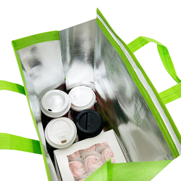 A green thermal bag filled with coffee and various items