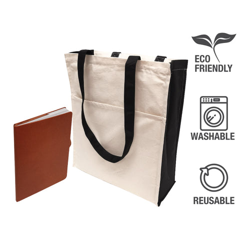 A plain tote bag with black handles and a notebook